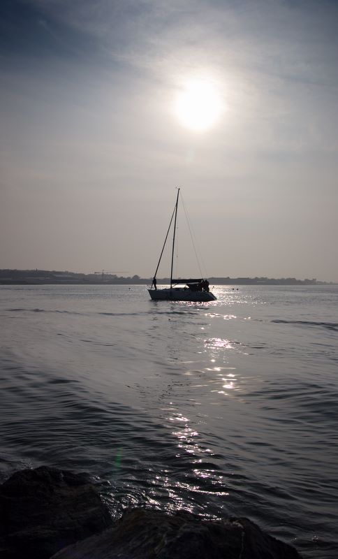 Sailing past Sunset: Howth - coast of Northern Co. Dublin, Ireland.