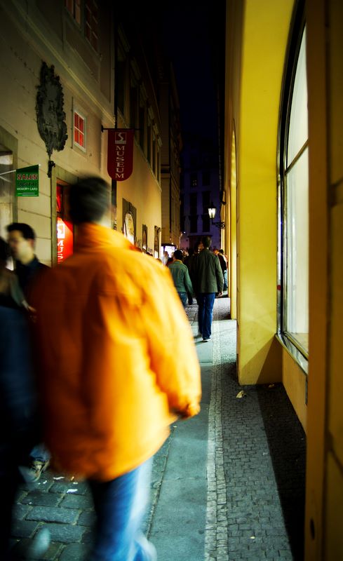 Night Walks: Tourist just off Old Town Square, Prague, Czech Republic.