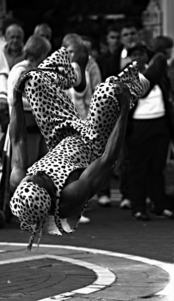 Build Up: Street entertainer preparing to do his finale, across from the entrance to St. Stephen's Green, Dublin, Ireland.